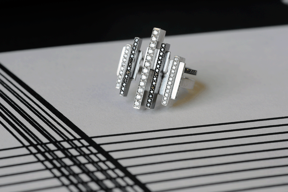 Art deco inspired ring on a black and white line drawing.