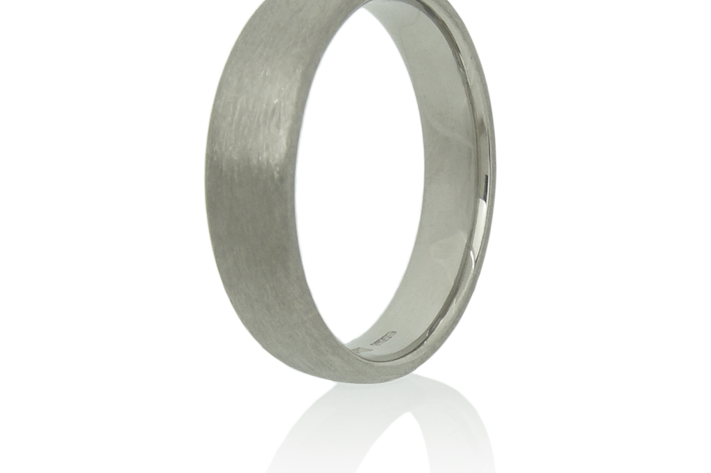 5mm wide 18k white gold ring with a brushed finish standing upright against a white background.