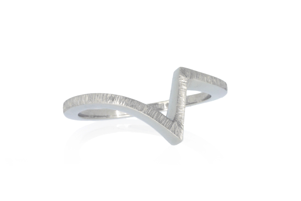 Zig-zag wedding ring in platinum set against a white background.
