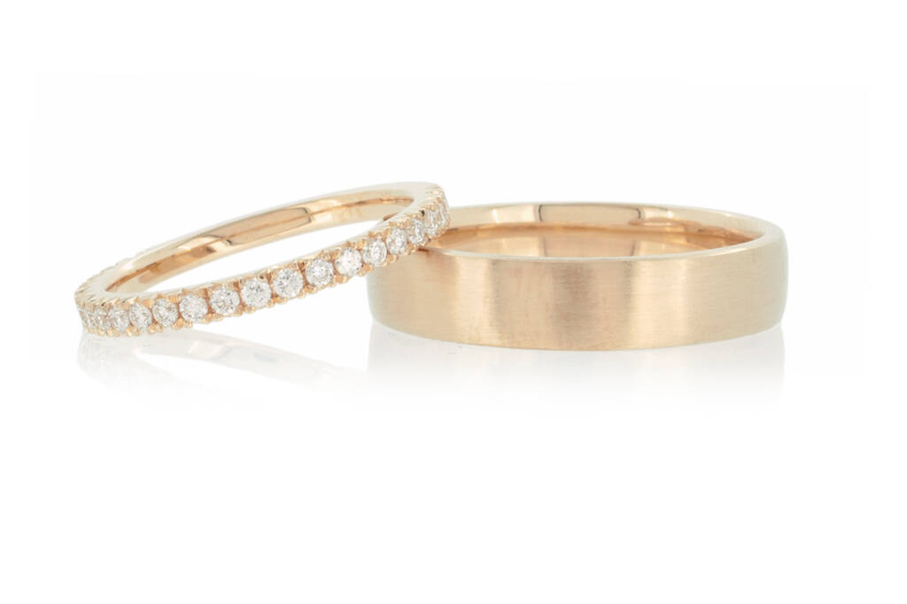 Diamond eternity ring and man's wedding band in light rose gold