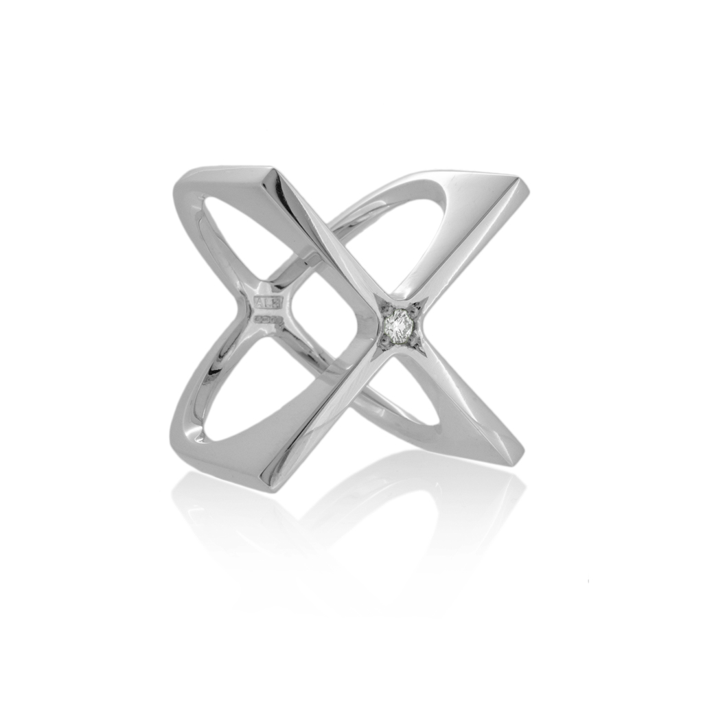 silver sculptural ring in the shape of a 3D X, with central diamond, on a white background
