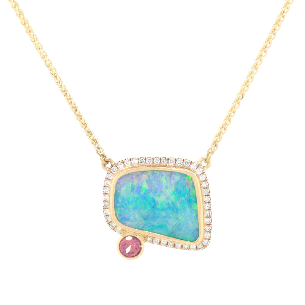 Boulder opal, diamond and padparadscha sapphire hanging on a gold chain on a white background.