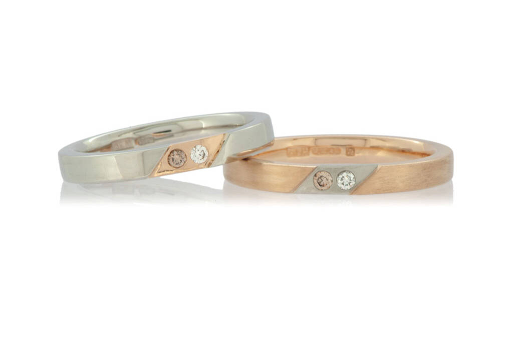 Two rings in rose gold and platinum with inset colourless and champagne diamonds on a white background.
