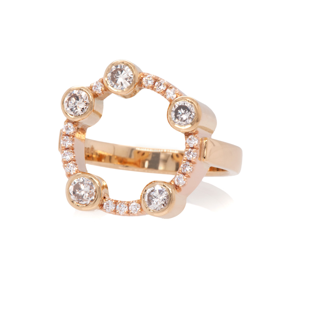 A ring with a circle of diamonds set in yellow and red gold on a white background.