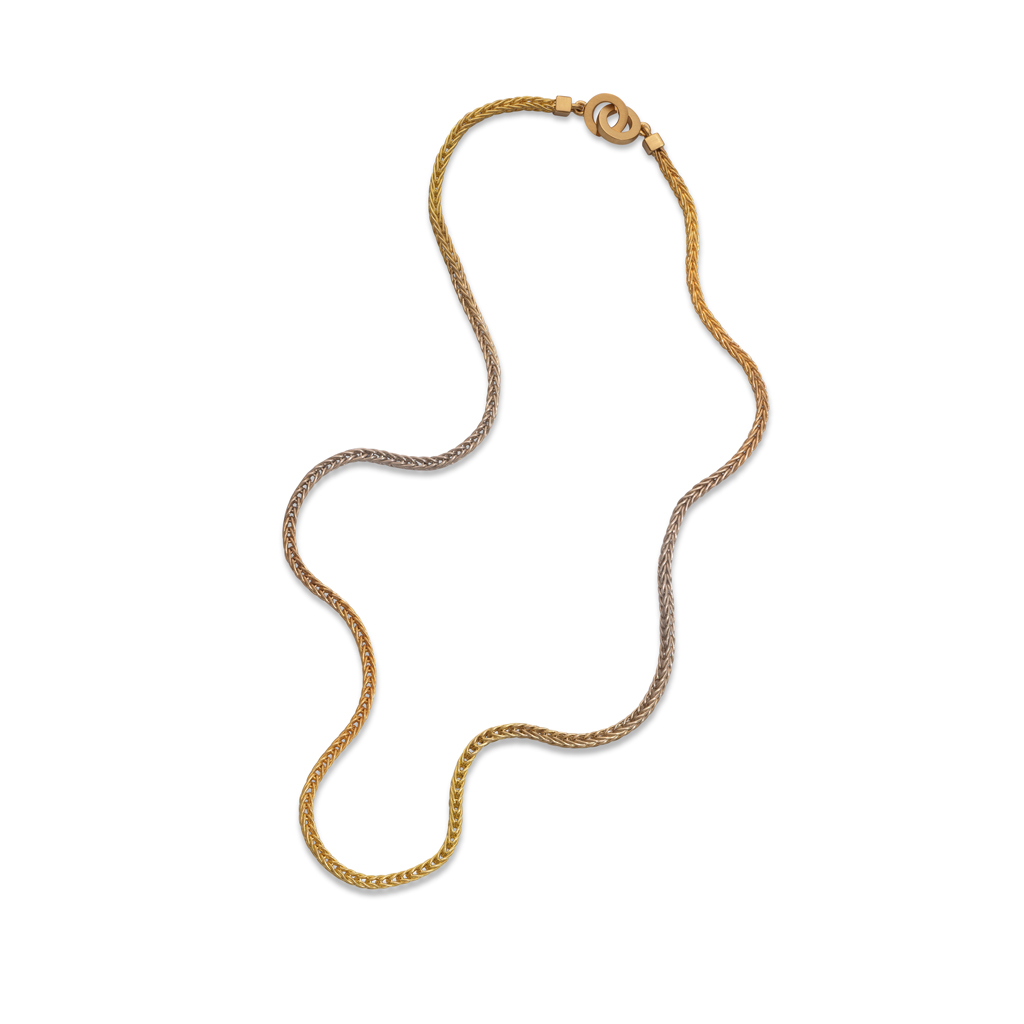Flat lay of gold gradient chain necklace subtly changing colour from 22k white, red to yellow gold on white background