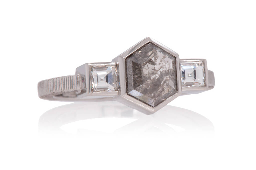 Rose cut salt and pepper diamond set in platinum with two square carré either side on a white background.